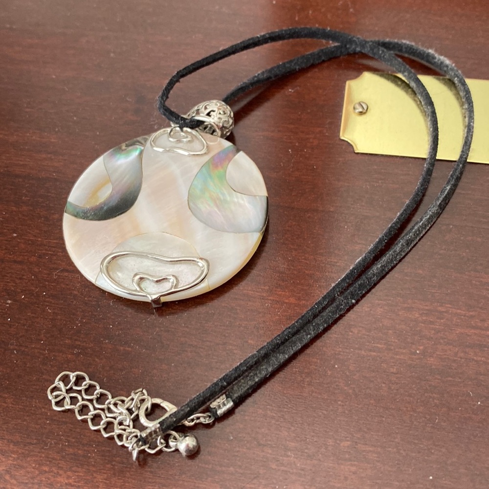 Round shell and silver pendant necklace